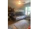 This bedroom features a window, ceiling fan, and a bunk bed at 288 Harper Se Rd, Atlanta, GA 30315