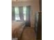 Bedroom featuring a large window and a chest at 288 Harper Se Rd, Atlanta, GA 30315