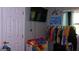 Bedroom with clothing rack, television and toy storage unit at 288 Harper Se Rd, Atlanta, GA 30315