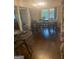 Bright dining room with hardwood floors, large windows, and a stylish light fixture at 288 Harper Se Rd, Atlanta, GA 30315