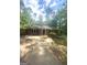 Charming brick home featuring a well-maintained front yard and driveway with mature trees providing ample shade at 288 Harper Se Rd, Atlanta, GA 30315
