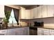 Kitchen showcasing white cabinets, granite countertops, and stainless steel appliances at 288 Harper Se Rd, Atlanta, GA 30315