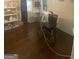Office space with hardwood floors, next to dining room, featuring a desk and ample storage at 288 Harper Se Rd, Atlanta, GA 30315
