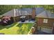 Aerial view of a brick home with a patio set and landscaped backyard at 110 Woodland Rd, Fayetteville, GA 30214