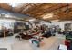 Finished basement space with exposed ceiling beams, sitting area, and additional storage at 110 Woodland Rd, Fayetteville, GA 30214