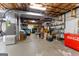 Spacious basement with utilities, large storage capacity, and Coca-Cola refrigerator at 110 Woodland Rd, Fayetteville, GA 30214
