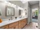 Bright bathroom with a double sink vanity and view to a sitting area, inviting comfort at 110 Woodland Rd, Fayetteville, GA 30214