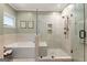 A luxurious bathroom offering separate tub and glass-enclosed shower with seat at 110 Woodland Rd, Fayetteville, GA 30214