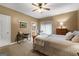 Inviting bedroom featuring a cozy bed, adjacent office desk, and warm, natural lighting at 110 Woodland Rd, Fayetteville, GA 30214