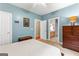 Charming bedroom with a view to the bathroom, offering convenience and style at 110 Woodland Rd, Fayetteville, GA 30214