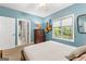 Bright bedroom with view of bathroom and an open closet, creating a spacious feel at 110 Woodland Rd, Fayetteville, GA 30214