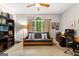 Inviting bedroom providing futon, study area, and natural outdoor views at 110 Woodland Rd, Fayetteville, GA 30214