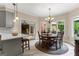 Inviting dining area with wood table set and bright views of the outdoors at 110 Woodland Rd, Fayetteville, GA 30214