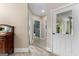 Hallway with views of the home's neutral interior, with tiled floors and white door frames at 110 Woodland Rd, Fayetteville, GA 30214