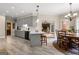 Open kitchen with gray cabinets, white countertops, and a breakfast bar with views to the living room at 110 Woodland Rd, Fayetteville, GA 30214