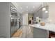 Modern kitchen with stainless steel appliances, gray cabinets and a peninsula with bar seating at 110 Woodland Rd, Fayetteville, GA 30214