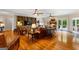Spacious living room with hardwood floors, built-in shelving, fireplace, and access to outdoor patio at 110 Woodland Rd, Fayetteville, GA 30214