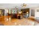 Spacious living room with hardwood floors, ceiling fans, and built-in shelving at 110 Woodland Rd, Fayetteville, GA 30214