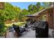 Inviting outdoor patio with seating and views of landscaped yard at 110 Woodland Rd, Fayetteville, GA 30214