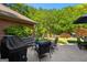 Patio features furniture, grill, and landscaped yard at 110 Woodland Rd, Fayetteville, GA 30214
