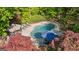 Aerial view of a private pool area with lounge chairs and lush greenery, creating a relaxing oasis at 110 Woodland Rd, Fayetteville, GA 30214