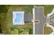 Aerial view of the community pool and landscaping, showcasing its setting and amenities at 240 Epping Dr, Stockbridge, GA 30281