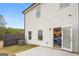 The backyard has a small grassy yard and a concrete patio, perfect for outdoor entertaining at 240 Epping Drive, Stockbridge, GA 30281