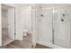 Modern bathroom with a glass-enclosed shower and a separate toilet room at 240 Epping Drive, Stockbridge, GA 30281