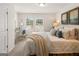 Bright bedroom with a comfortable bed, bedside tables, and a view of the outdoors at 240 Epping Drive, Stockbridge, GA 30281
