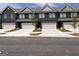 New townhome construction showcasing brick facades, attached garages, and manicured lawns at 240 Epping Drive, Stockbridge, GA 30281