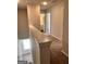 Upstairs hallway featuring carpet, with views of the stairway and a bathroom through doorways at 240 Epping Drive, Stockbridge, GA 30281