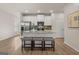 Modern kitchen with stainless steel appliances, granite counters, and center island with bar stool seating at 240 Epping Drive, Stockbridge, GA 30281