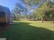 Spacious, well-manicured backyard with lush trees and a neatly kept lawn, offering plenty of space at 150 Park Timbers Drive, Sharpsburg, GA 30277