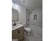 Newly remodeled bathroom featuring stylish vanity and tub with marbled tile surround and new fixtures at 150 Park Timbers Drive, Sharpsburg, GA 30277