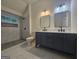 Modern bathroom with a glass-enclosed shower and a double sink vanity with marble countertops at 150 Park Timbers Drive, Sharpsburg, GA 30277