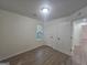 Bedroom with neutral walls, hardwood floors, a bright window, and an entrance way at 150 Park Timbers Drive, Sharpsburg, GA 30277