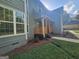 Charming home exterior showcasing architectural details like wood accents and a well-maintained landscape at 150 Park Timbers Drive, Sharpsburg, GA 30277