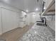 Granite counters and white cabinets highlight this bright kitchen with lots of storage space at 150 Park Timbers Drive, Sharpsburg, GA 30277
