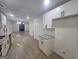 Beautifully updated kitchen with granite countertops, stainless steel appliances, and seamless flow into the living area at 150 Park Timbers Drive, Sharpsburg, GA 30277