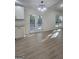 Bright kitchen showcasing white cabinets, granite countertops, and a double door to the outside deck at 150 Park Timbers Drive, Sharpsburg, GA 30277