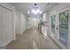 Stylish kitchen features white cabinets, modern lighting, and easy access to the deck through double doors at 150 Park Timbers Drive, Sharpsburg, GA 30277