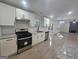 Bright kitchen with updated cabinets and countertops with an open view to the rest of the home at 150 Park Timbers Drive, Sharpsburg, GA 30277