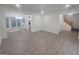 Bright living room features an open layout, hardwood floors, and large windows, creating a seamless flow at 150 Park Timbers Drive, Sharpsburg, GA 30277