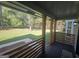 Inviting porch with wood columns and railings, offering a serene view of the lush front yard at 150 Park Timbers Drive, Sharpsburg, GA 30277