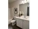 Bathroom featuring a single vanity with white cabinetry and modern fixtures at 256 Epping Drive, Stockbridge, GA 30281
