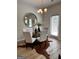 Dining room featuring a modern round table, stylish chairs, and elegant decor, complemented by a unique cowhide rug and wood look floors at 256 Epping Drive, Stockbridge, GA 30281