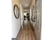 Inviting foyer featuring wood-look floors, contemporary decor, and a welcoming entrance hall with a clear view to the living room at 256 Epping Drive, Stockbridge, GA 30281