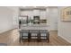 Stylish kitchen featuring a center island with seating, stainless steel appliances, and modern finishes at 256 Epping Drive, Stockbridge, GA 30281