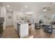 Open-concept living space with hardwood floors, modern furnishings, and stainless steel appliances at 256 Epping Drive, Stockbridge, GA 30281