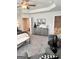 Main bedroom suite with sitting area, tray ceilings, and ensuite bathroom access at 256 Epping Drive, Stockbridge, GA 30281